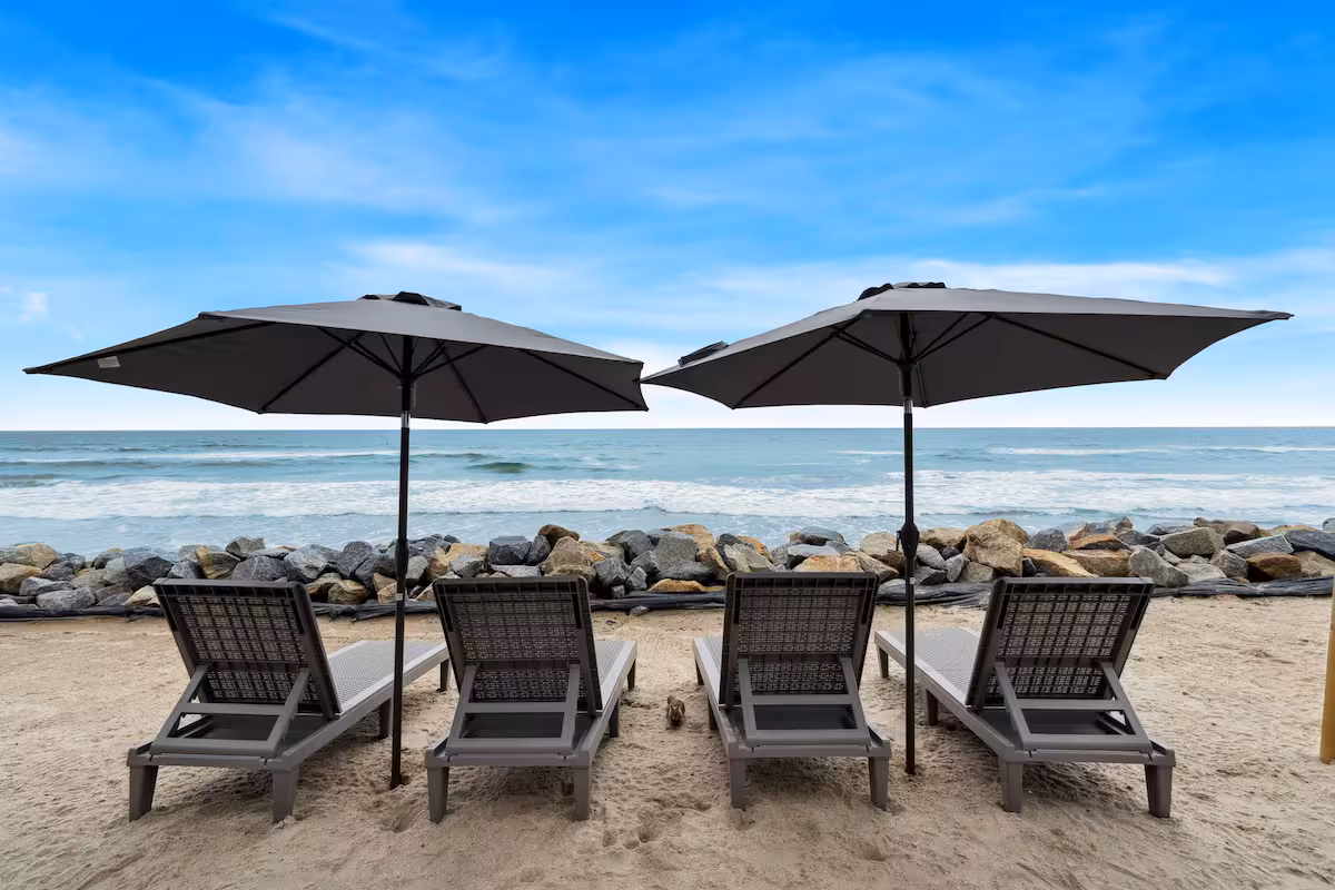 Ocean view from the sand beside the lounge chairs