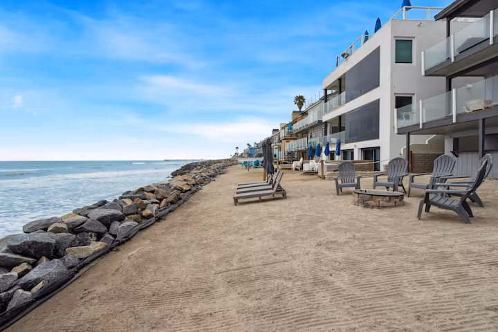 Side profile of beach lounge chairs in the sand
